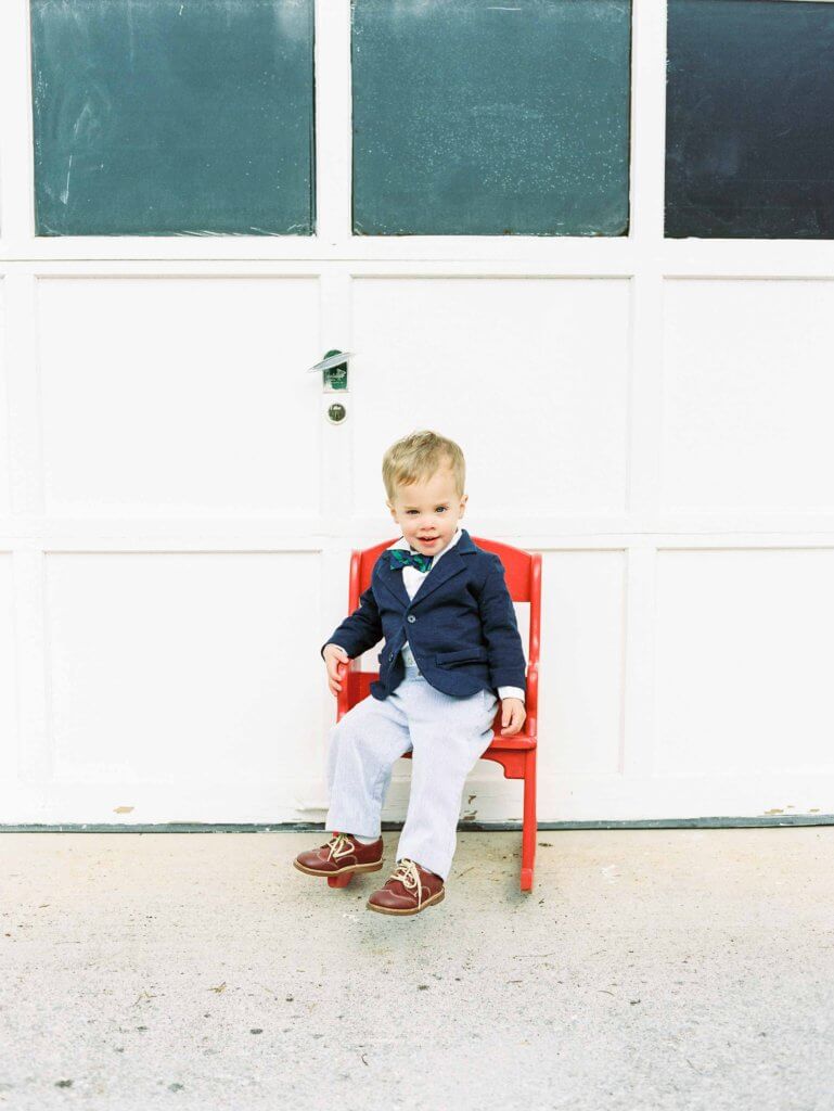 Boy in red chair in historic Knoxville neighborhood 