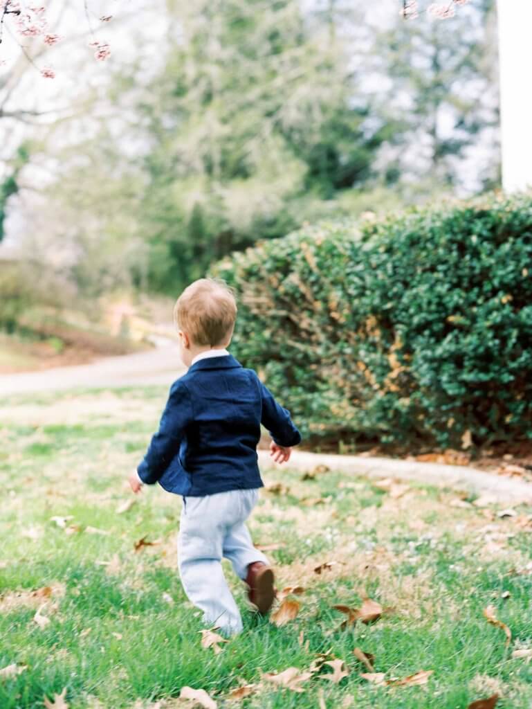 Boy running in yard